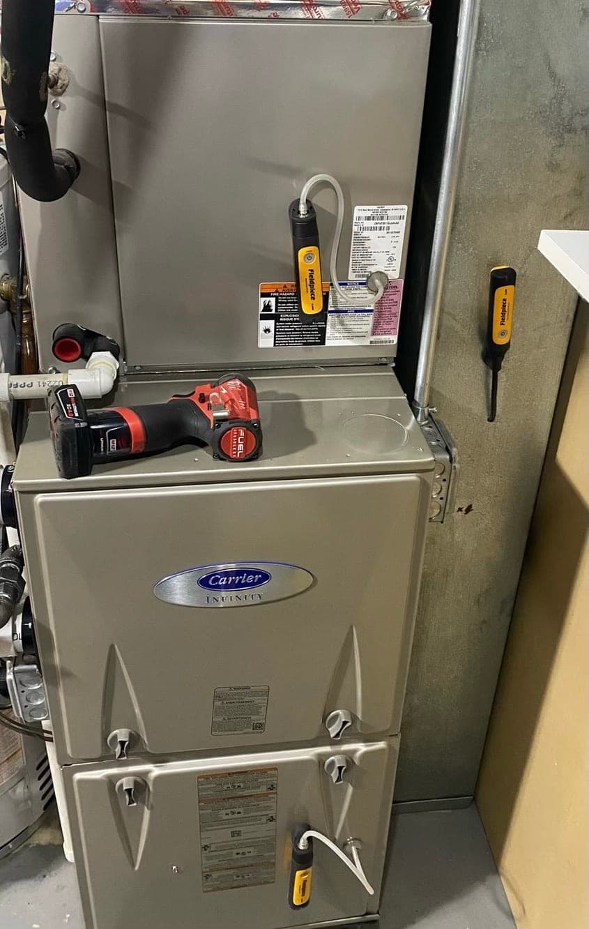New Carrier Infinity gas furnace and evaporator coil with wireless test probes attached at startup